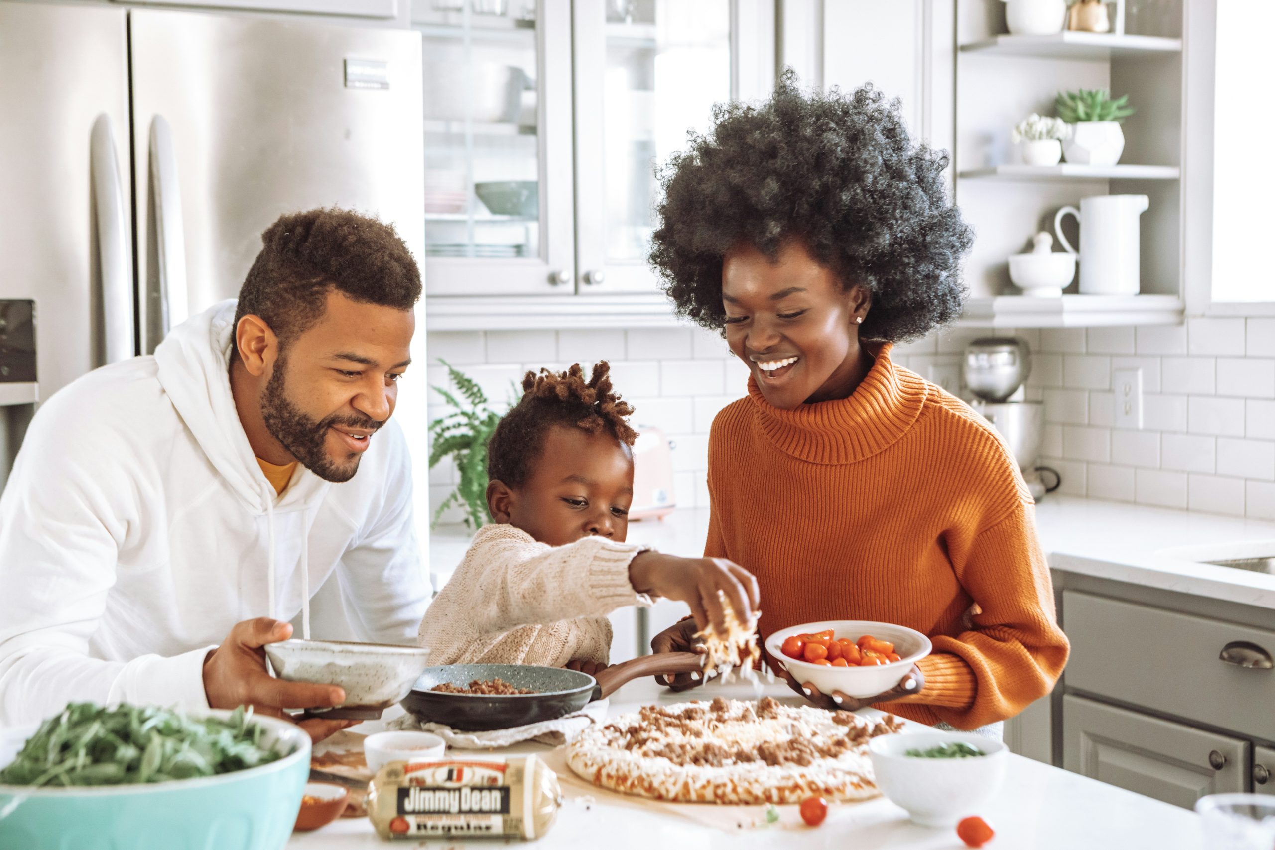 Family preparing food together in a bright kitchen